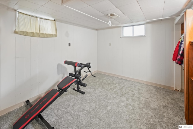 workout room featuring carpet floors, baseboards, and visible vents