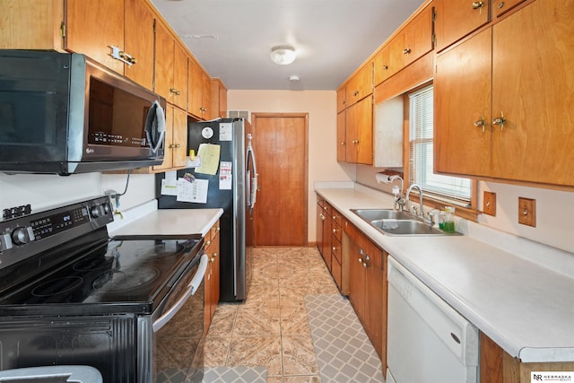kitchen with a sink, brown cabinets, black electric range, light countertops, and white dishwasher