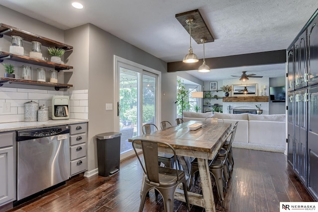 dining area with dark wood finished floors, ceiling fan, a fireplace, recessed lighting, and baseboards
