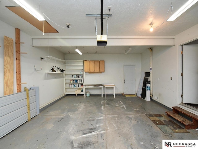 garage featuring baseboards and a garage door opener