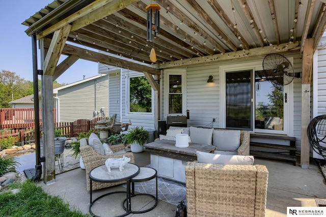 view of patio with fence and an outdoor hangout area