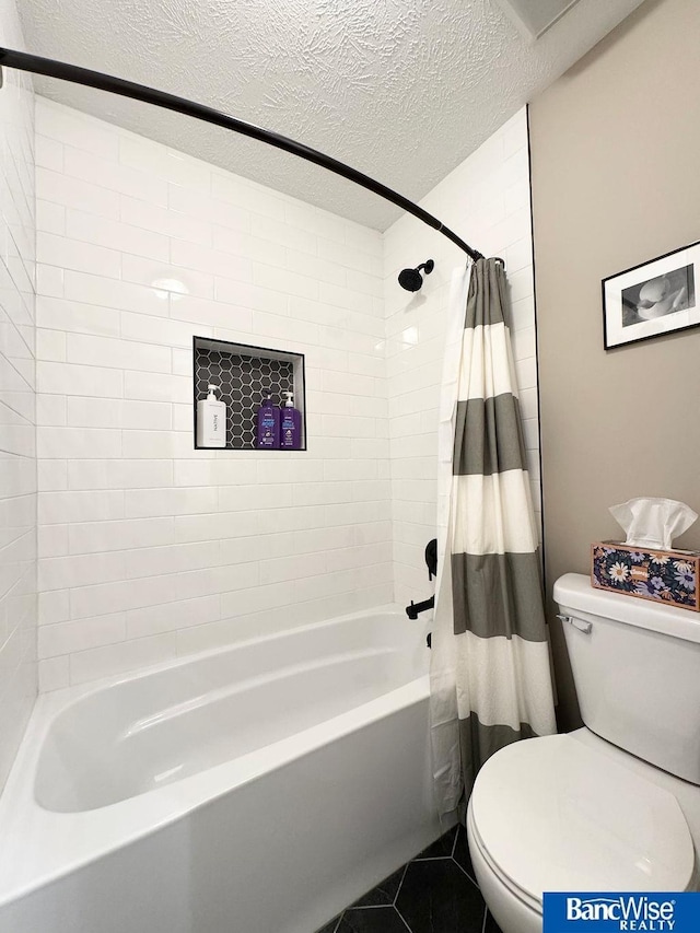 full bath with toilet, a textured ceiling, tile patterned floors, and shower / tub combo with curtain