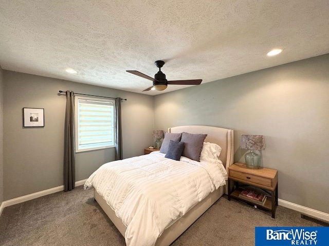 carpeted bedroom with baseboards, a textured ceiling, ceiling fan, and recessed lighting