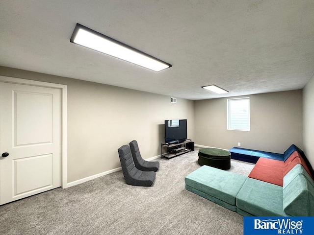 carpeted living room featuring baseboards