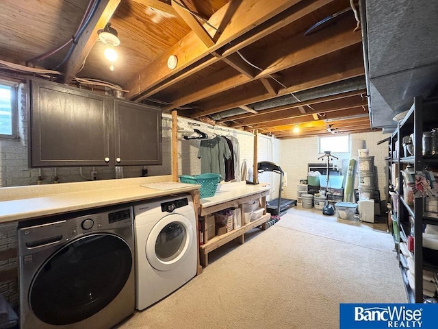 basement with washer and clothes dryer and carpet floors