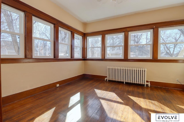 unfurnished sunroom with radiator