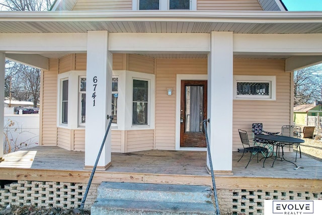 entrance to property featuring a porch