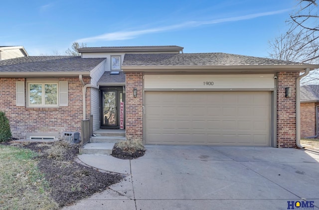 view of front facade featuring concrete driveway, brick siding, a garage, and roof with shingles