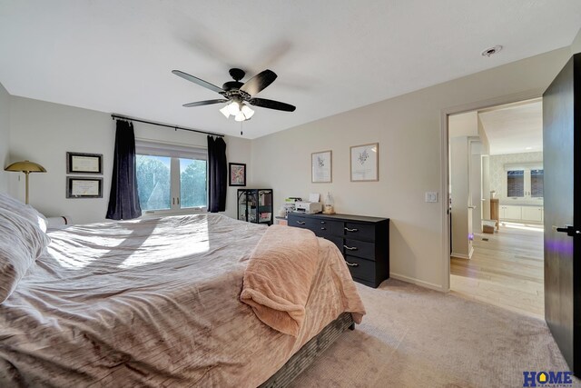 bedroom with light carpet, ceiling fan, and baseboards