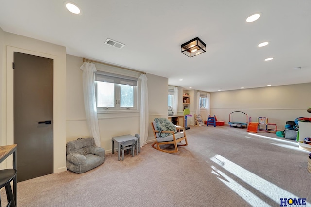 recreation room with carpet floors, recessed lighting, and healthy amount of natural light