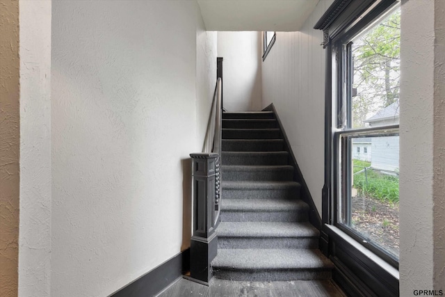 409 N 25th St, Lincoln, NE 68503 - stairway with a textured wall and baseboards