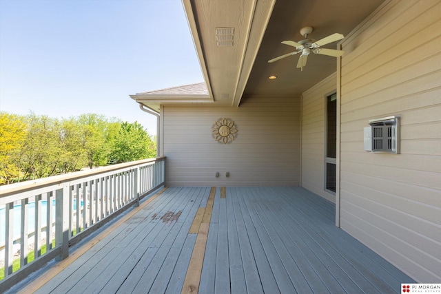 wooden terrace featuring ceiling fan