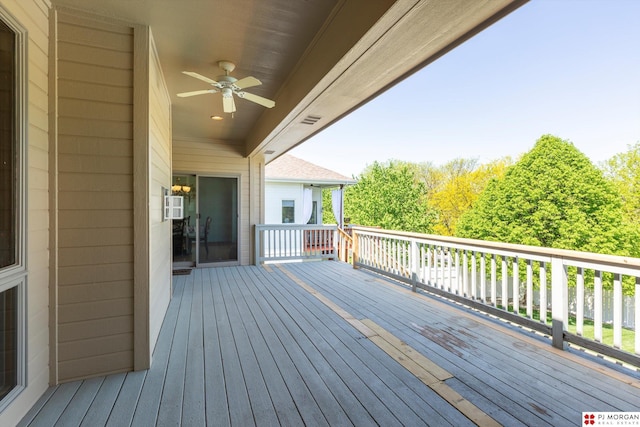 wooden deck featuring a ceiling fan