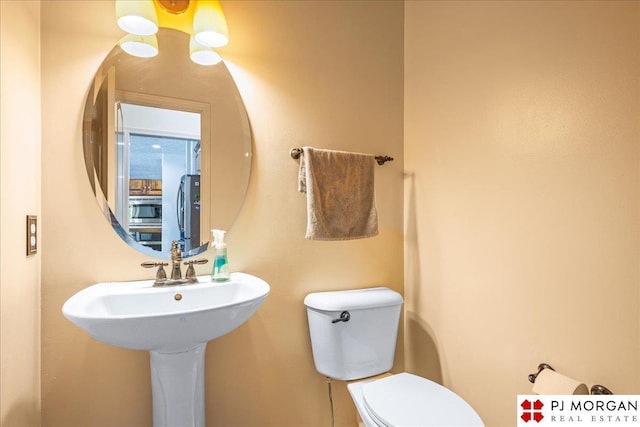half bathroom with toilet