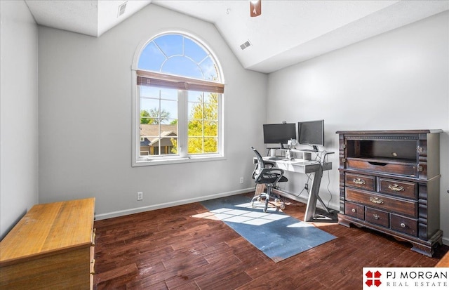 home office with vaulted ceiling, visible vents, and wood finished floors