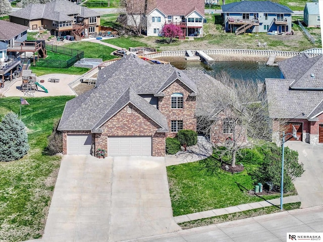 aerial perspective of suburban area featuring a large body of water