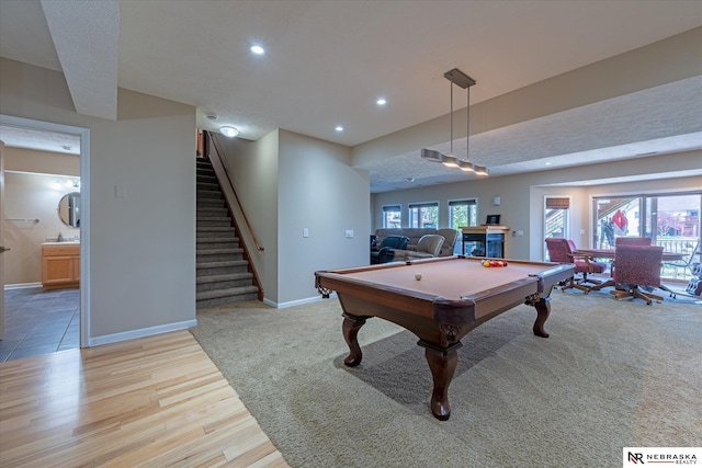 recreation room with pool table, recessed lighting, baseboards, light wood-style floors, and a sink
