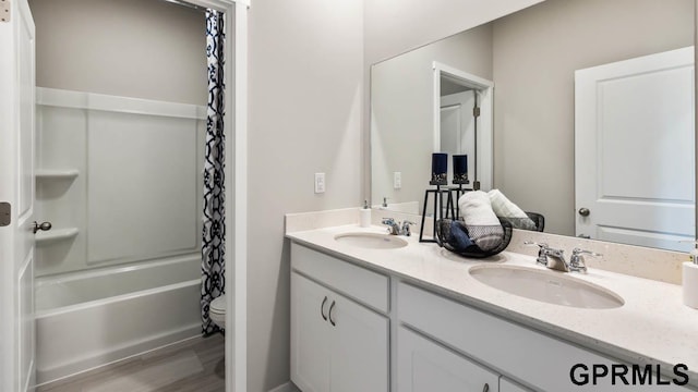 12314 S 204th Ave, Gretna, NE 68028 - bathroom featuring double vanity, wood finished floors, toilet, and shower / bathtub combination with curtain
