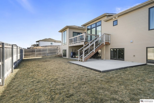 rear view of property with a patio area, stairs, and a deck