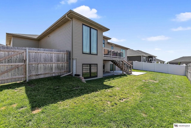 rear view of house with stairs and a deck