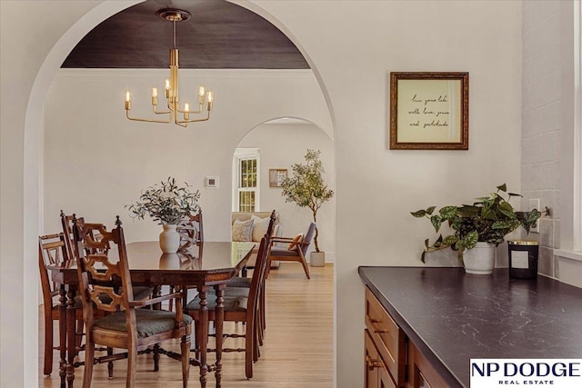 5650 Poppleton Ave, Omaha, NE 68106 - dining space with a chandelier and light wood-type flooring