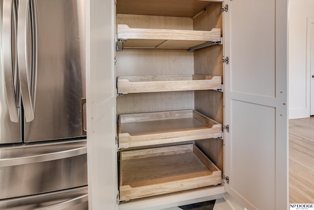 5650 Poppleton Ave, Omaha, NE 68106 - detailed view of freestanding refrigerator and wood finished floors