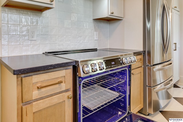 5650 Poppleton Ave, Omaha, NE 68106 - kitchen with stainless steel appliances and decorative backsplash