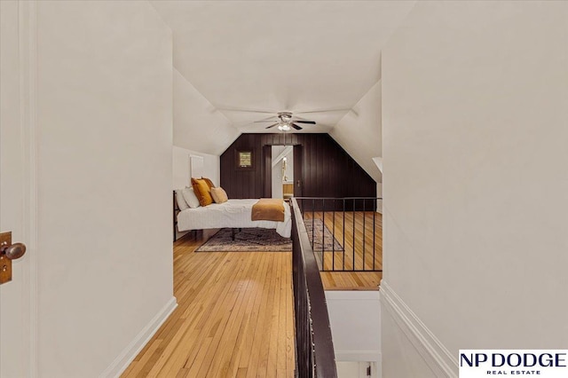 5650 Poppleton Ave, Omaha, NE 68106 - bedroom featuring vaulted ceiling, wood-type flooring, and a ceiling fan