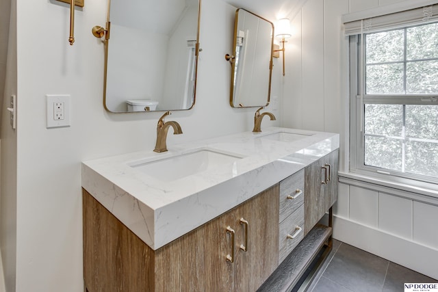 5650 Poppleton Ave, Omaha, NE 68106 - bathroom with double vanity and tile patterned flooring