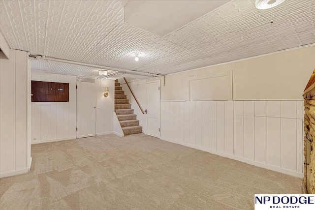 5650 Poppleton Ave, Omaha, NE 68106 - finished below grade area featuring stairway, carpet flooring, and wooden walls