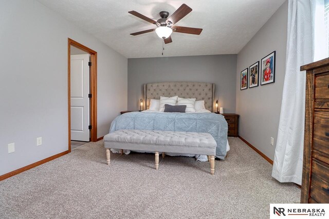 bedroom with carpet, baseboards, and a ceiling fan