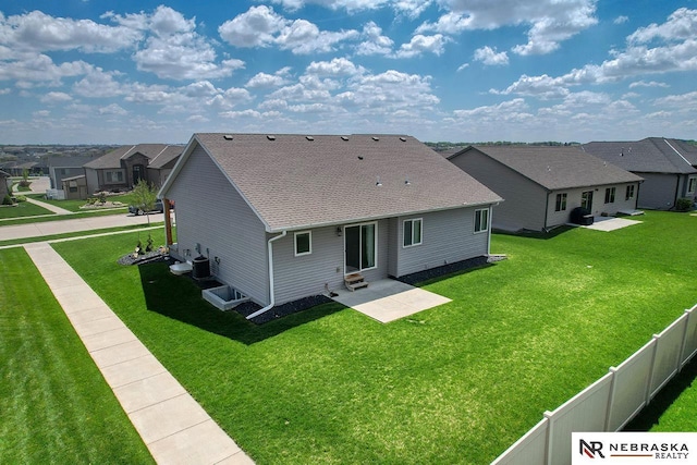 back of house featuring a residential view, a patio area, roof with shingles, entry steps, and central air condition unit