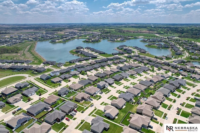 aerial perspective of suburban area featuring a large body of water
