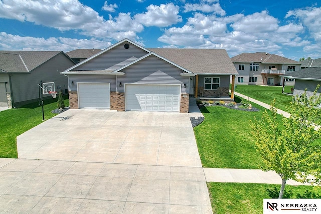 view of front of house with a garage, a front yard, driveway, brick siding, and covered porch