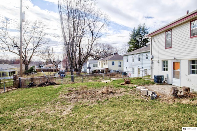 view of yard with cooling unit and a residential view