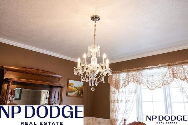 detailed view of a chandelier, ornamental molding, and a textured ceiling
