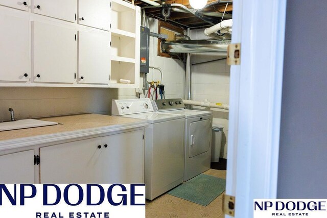 laundry area featuring cabinet space and washing machine and clothes dryer
