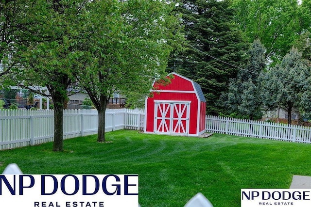 view of yard with a shed and an outbuilding