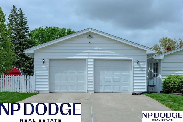 garage with fence