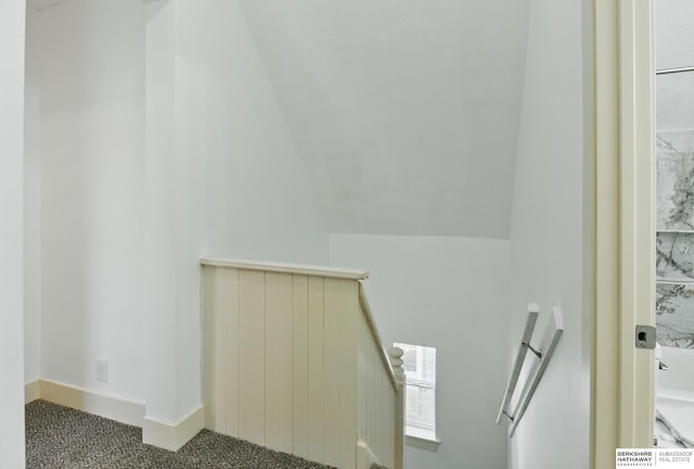 detailed view of carpet flooring and baseboards