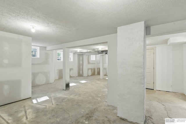 basement with a textured ceiling