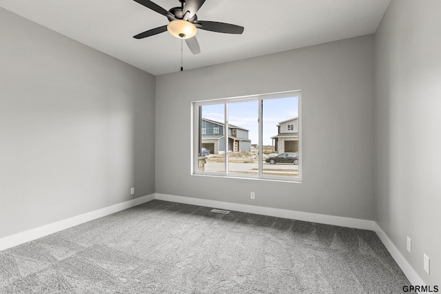 235 N 105th St, Lincoln, NE 68527 - carpeted spare room featuring baseboards and a ceiling fan