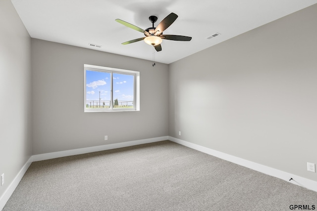 235 N 105th St, Lincoln, NE 68527 - empty room featuring ceiling fan, carpet floors, and baseboards