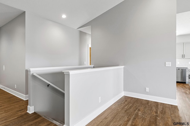 235 N 105th St, Lincoln, NE 68527 - corridor featuring an upstairs landing, wood finished floors, baseboards, and recessed lighting