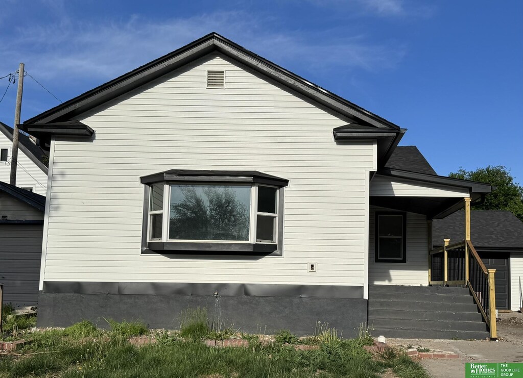 view of property exterior featuring a porch