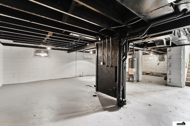 2139 S 8th St, Lincoln, NE 68502 - unfinished basement featuring water heater and stairs