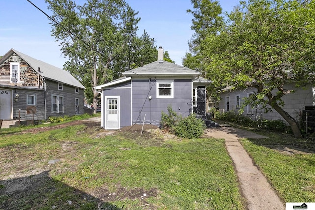 2139 S 8th St, Lincoln, NE 68502 - rear view of house with a chimney
