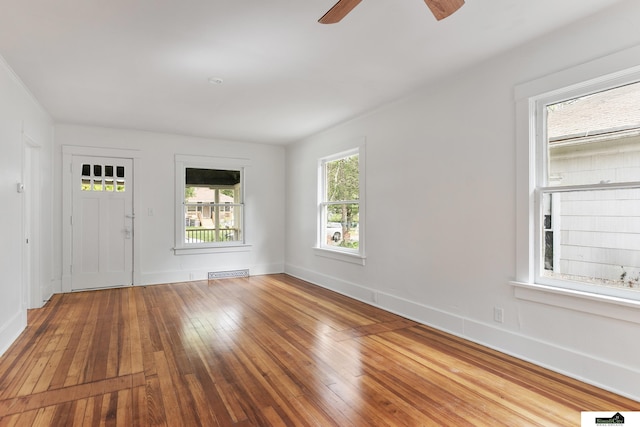 2139 S 8th St, Lincoln, NE 68502 - unfurnished room with hardwood / wood-style flooring, a ceiling fan, and baseboards