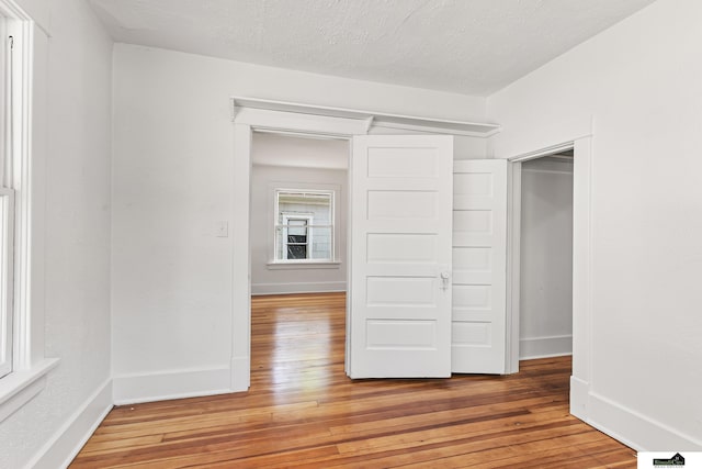 2139 S 8th St, Lincoln, NE 68502 - unfurnished bedroom featuring light wood finished floors and baseboards