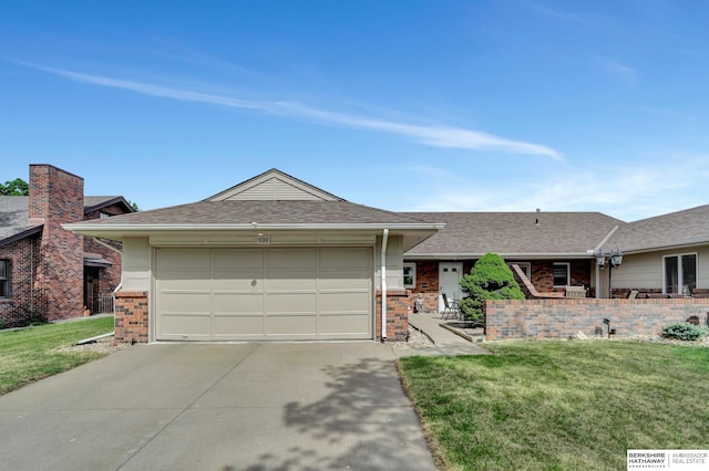 single story home featuring brick siding, concrete driveway, and a front lawn